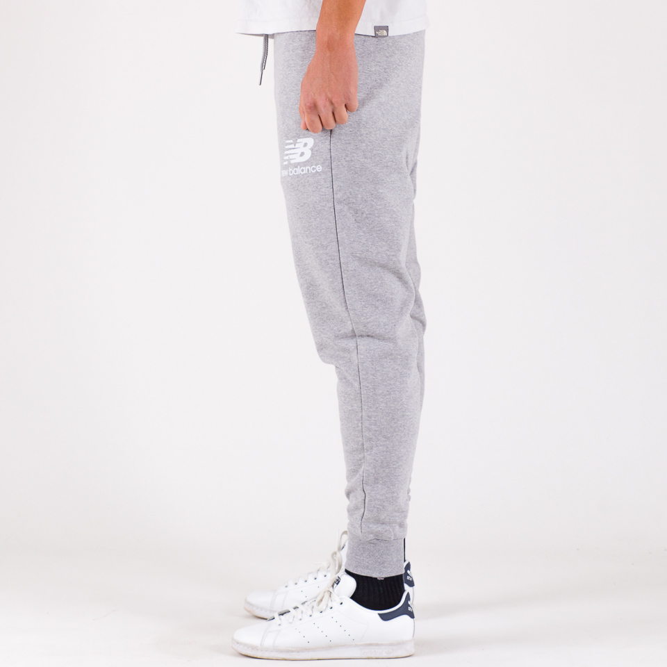 Shop New Balance Essential Stacked Logo Sweatpants MP03558-AG grey