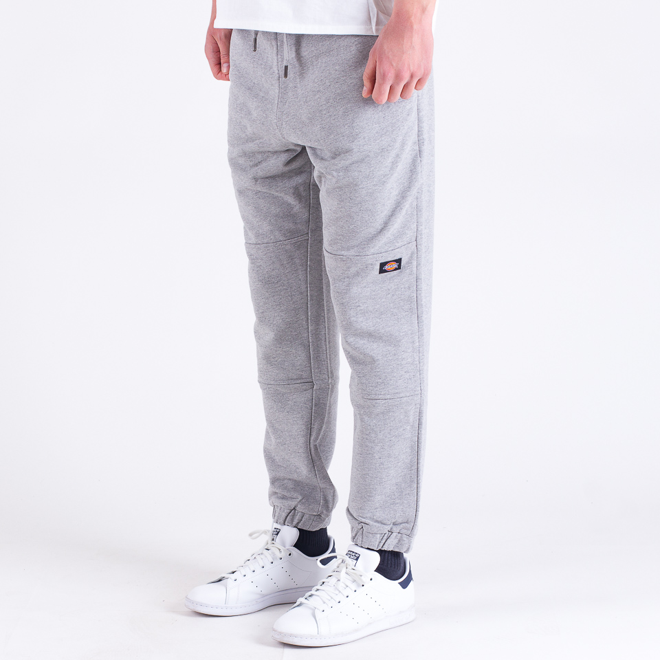 Shop New Balance Essential Stacked Logo Sweatpants MP03558-AG grey